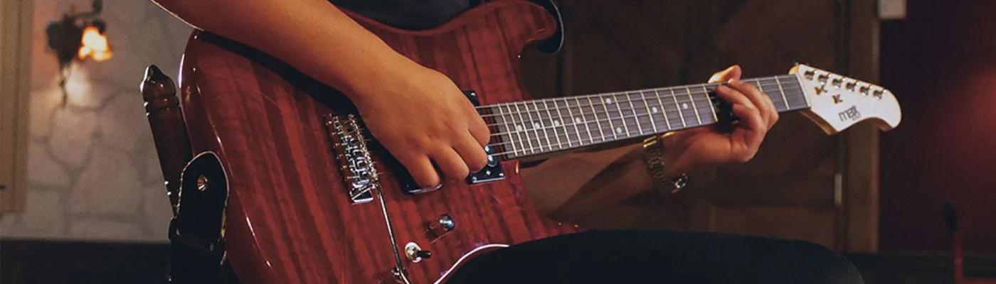 Is an Electric Guitar Better than an Acoustic? Max Soloist Guitar with Red Flame Top being played